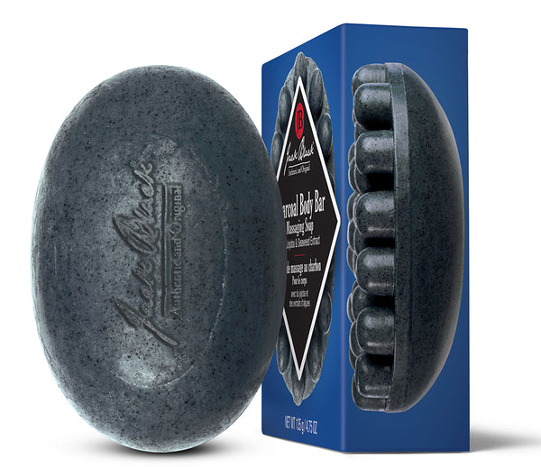 Jack Black charcoal body bar massaging soap with a blue box beside